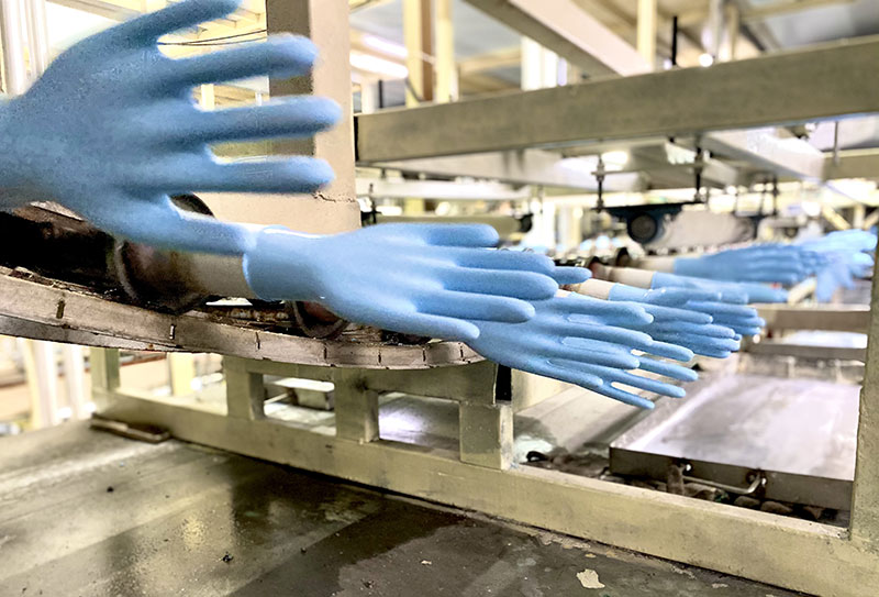 Nitrile gloves on the dipping line